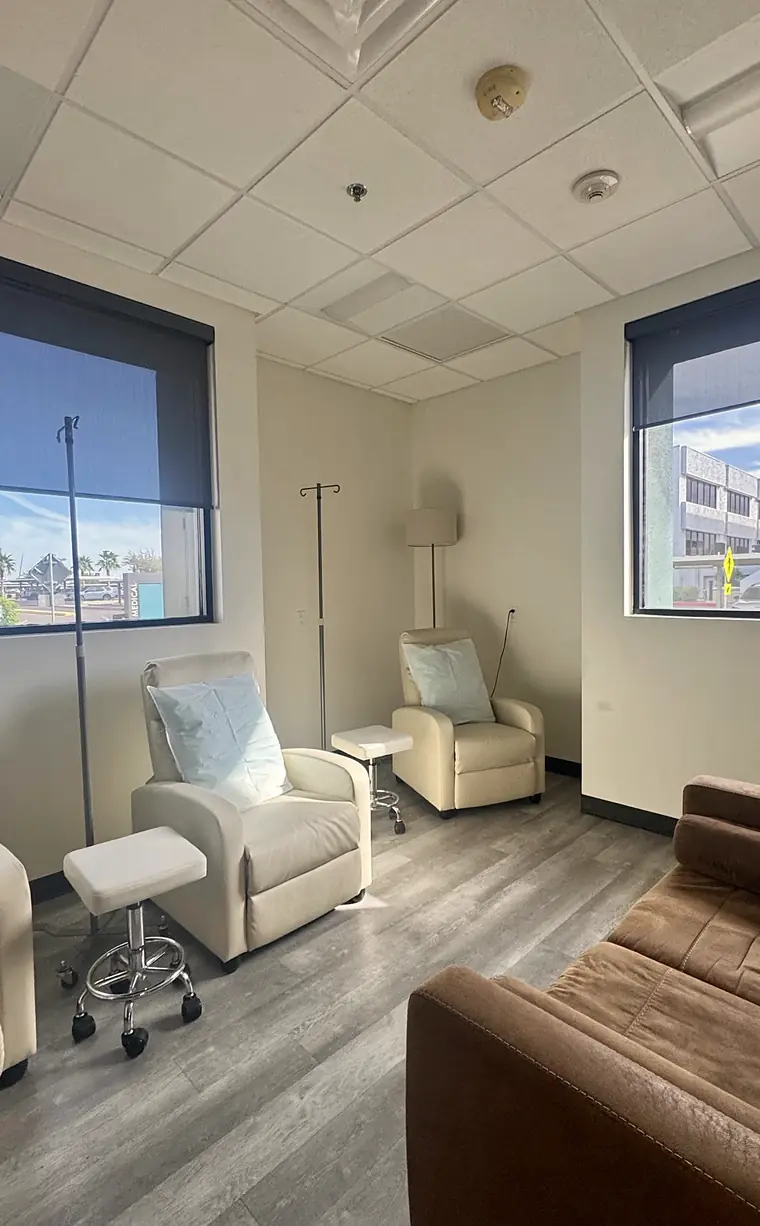 PISO Medical’s IV lounge: cream recliners beside tall windows overlooking the Banner Desert campus