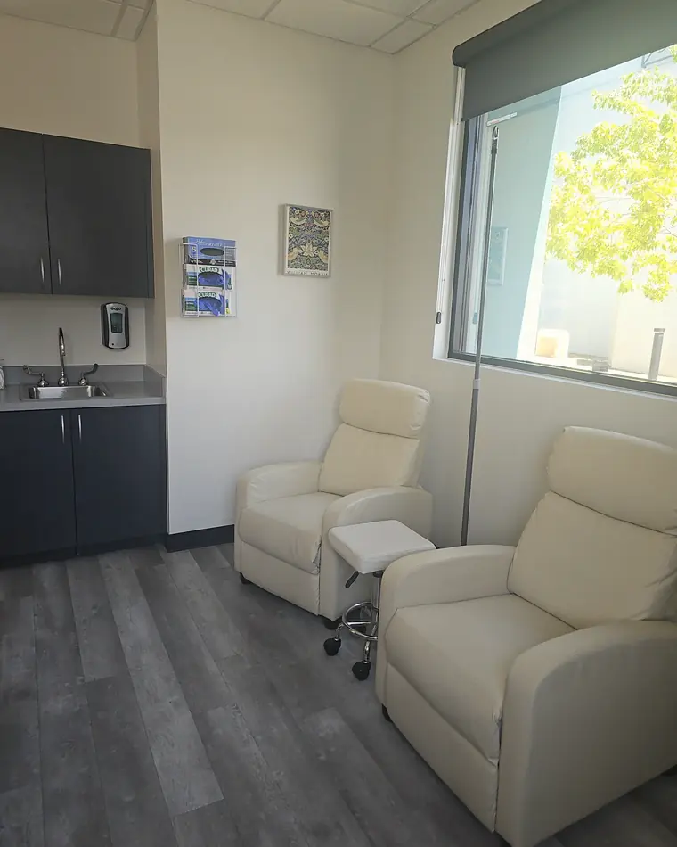 Recliners in PISO's IV lounge, with a tall window and soft daylight
